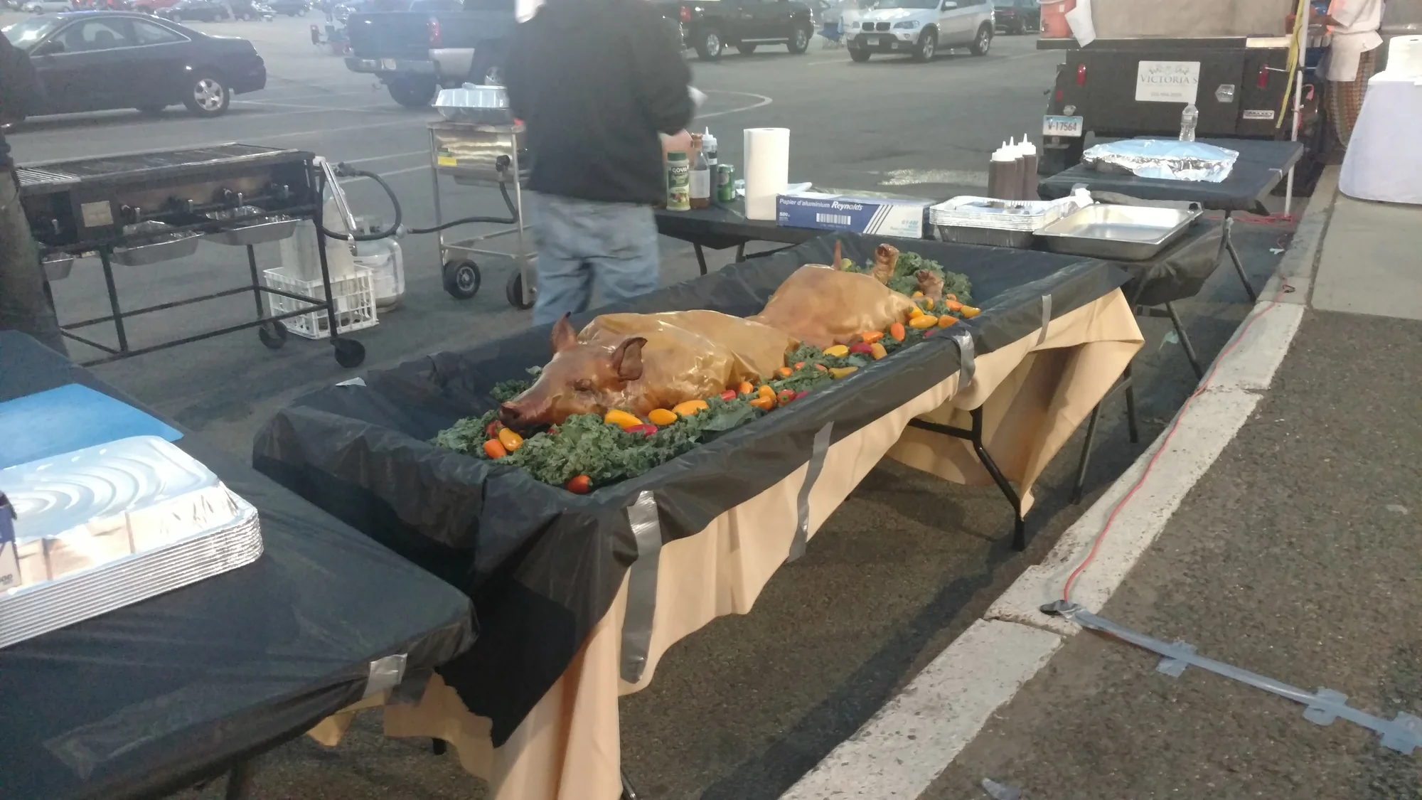 Chafing dishes of food set up on a tented buffet