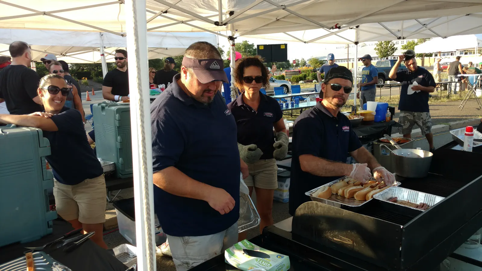The crew working the grills over live fire