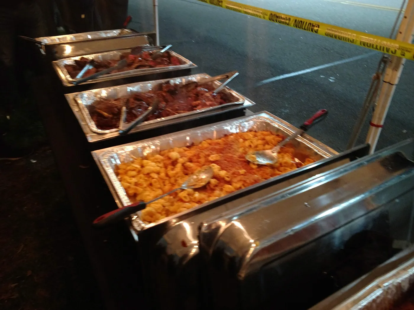 Trays of saucy wings and grilled food