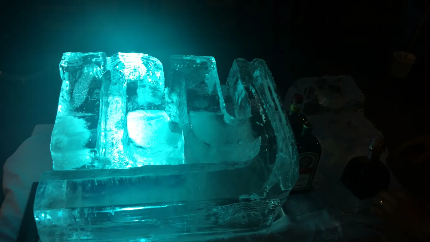 An illuminated ice sculpture at a premium event